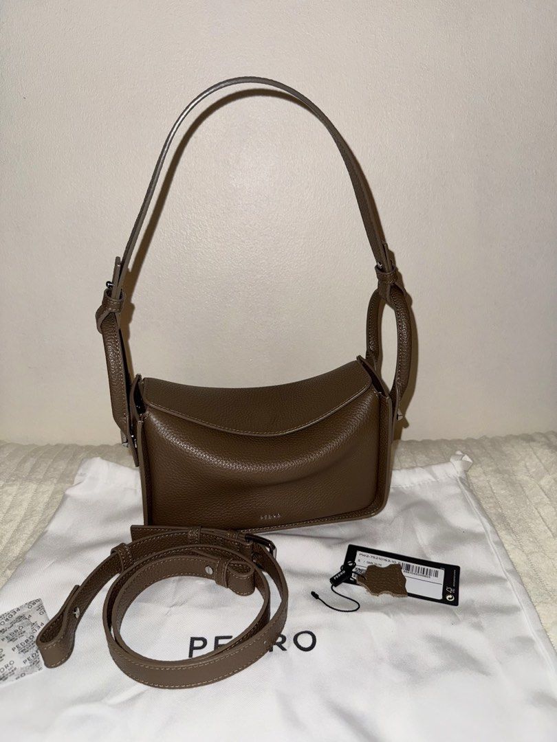 Pedro Demi Bag Dark Taupe (Category: Shoulder Bags) located in Manila. Submitted by lilially (Listing ID 1469510654, Image 1). Description: Demi Bag Regular Size Color: Dark Taupe Style: Flap Shoulder Bag / Crossbody Bag Material: Embossed Calf Leather Strap: Adjustable and detachable long strap Design: Minimalist silhouette with flap closure Condition: Lightly new with original tag and dust bag SRP: Php6,399 Bought via their Website (check last 