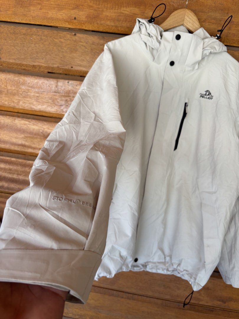 Pelliot Storm Breath Waterproof Windproof Hooded Jacket Off-White (Category: Coats, Jackets and Outerwear) located in Dipolog. Submitted by dionato (Listing ID 1469428071, Image 2). Description: - Brand/Model: Pelliot Outdoor Jacket - Color: Off-white - Material/Tech: Storm Breath tech fabric (waterproof, windproof, breathable) - Features: Drawstring hood, zipper chest pocket, adjustable hem, and inner brand detailing - Best for: Hiking, camping,