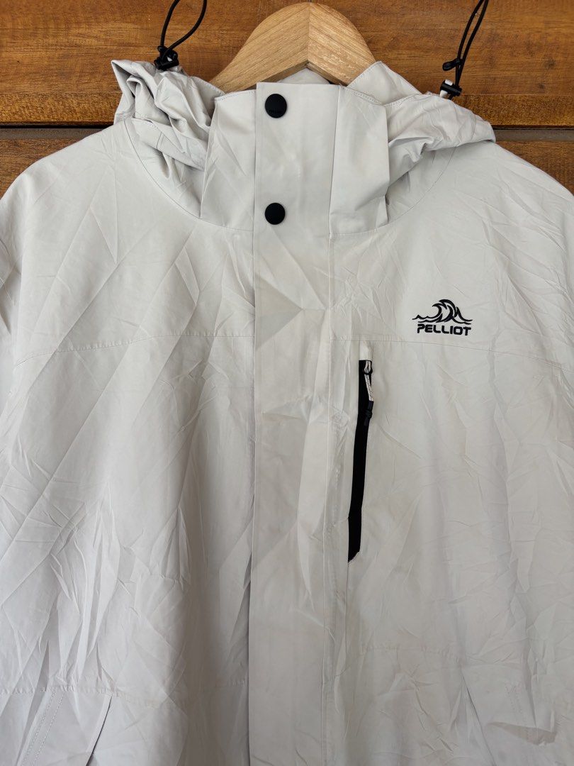Pelliot Storm Breath Waterproof Windproof Hooded Jacket Off-White (Category: Coats, Jackets and Outerwear) located in Dipolog. Submitted by dionato (Listing ID 1469428071, Image 3). Description: - Brand/Model: Pelliot Outdoor Jacket - Color: Off-white - Material/Tech: Storm Breath tech fabric (waterproof, windproof, breathable) - Features: Drawstring hood, zipper chest pocket, adjustable hem, and inner brand detailing - Best for: Hiking, camping,