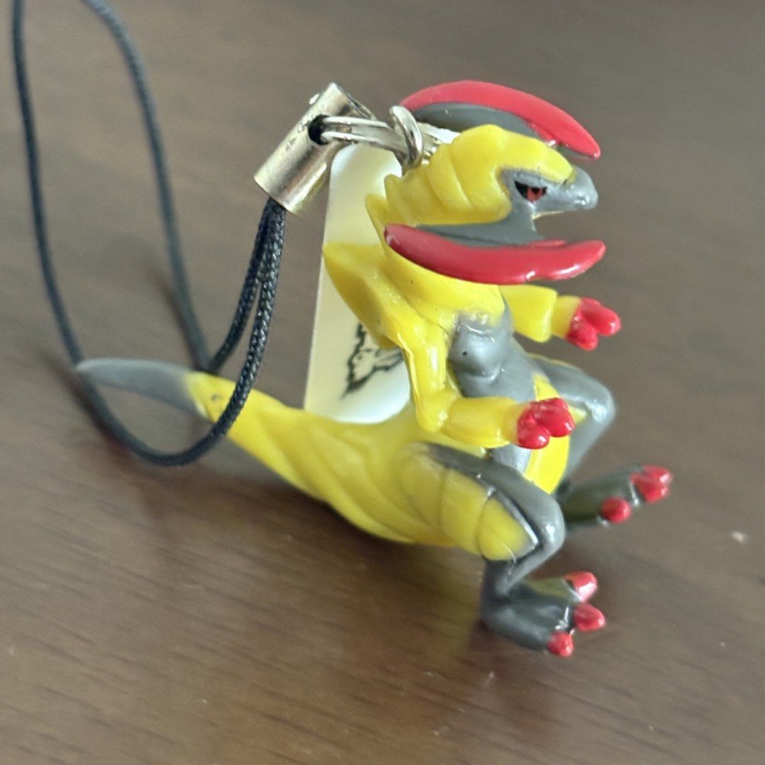 Pepsi Pokemon Haxorus Collection Strap (Category: Character Goods) located in Manila. Submitted by aobacafe (Listing ID 1469454354, Image 2). Description: - Official Pepsi Pokemon Collection strap featuring Haxorus (Best Wishes) - Rare promotional item imported from Japan - Detailed yellow and grey dragon figure with distinct red blade horns and claws - Includes strap and tag attached directly to the figurine - Comes with the original opened foil