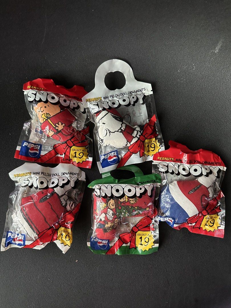 PEPSI Snoopy Peanuts Xmas tree Ornaments (Category: Plushies & Soft Toys) located in Cainta. Submitted by mochimochiko (Listing ID 1469417523, Image 1). Description: - Set of 5 PEPSI x Peanuts mini pillow christmass tree doll ornaments - Brand new and sealed in original packaging - Features festive holiday designs including Charlie Brown, Snoopy in Santa hat, Christmas wreath, and Pepsi globe - Great collectible set or gift for Peanuts fans.
