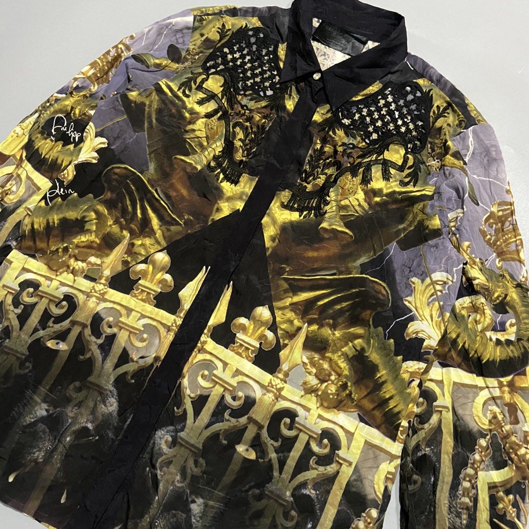 Philipp Plein Couture Pre-Fall 2014/15 Button Down (Category: Tshirts & Polo Shirts ) located in Cebu City. Submitted by johngregmoldez03 (Listing ID 1469483987, Image 3). Description: Philipp Plein Couture Pre-Fall 2014/15 Button Down Size: Medium on tag Dimension: 19.5 Width / 27 Length Color Rate: 10/10 Excellent to New Need Wash Only - 95% Silk Chiffon - 5% Elasthan Pm📩.