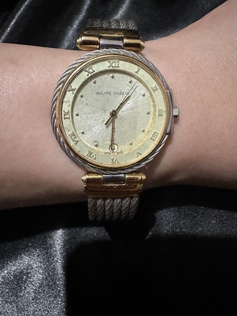 Philippe Charriol Swiss Quartz Watch (Category: Women's Watches) located in Makati City. Submitted by shebree (Listing ID 1469544801, Image 1). Description: - Brand: Philippe Charriol - Design: Two-tone silver and gold finish with iconic cable strap -Authentic Issue: Not working, needs machine replacement.