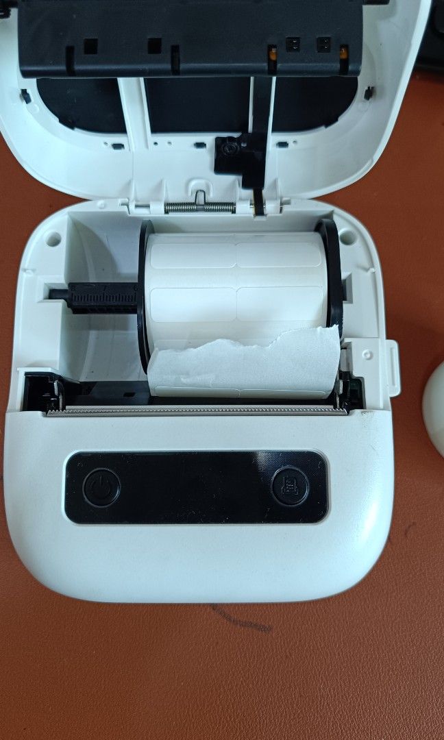Phomemo white M220 thermal label printer (Category: Art & Prints) located in Makati City. Submitted by jstreasuredfinds (Listing ID 1469460445, Image 3). Description: The Phomemo M220 is a portable, inkless 3-inch thermal label printer. It supports label widths from 20mm to 75mm (0.78 to 3.14 inches), connects via Bluetooth or USB, and works with iOS, Android, Windows, and Mac. Good working condition. Rfs: upgrade to other model.