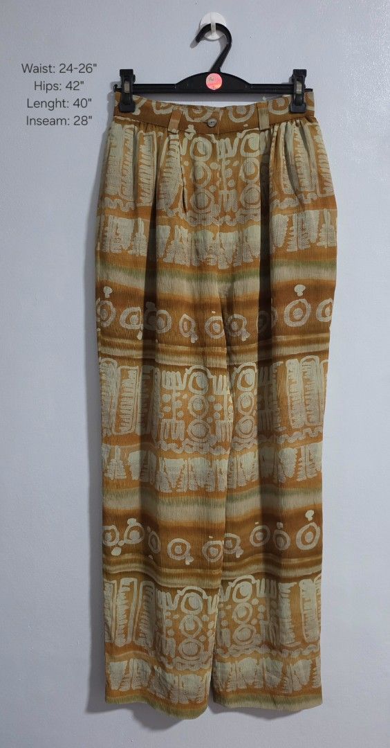 Più costare Patterned High-Waist Trousers (Category: Jeans) located in Paranaque City. Submitted by franinnashop (Listing ID 1469478926, Image 1). Description: Declutter - Style: High-waist, relaxed wide-leg trousers - Design: Striking orange and beige pattern - Features: Functional side pockets, belt loops, and front button closure - Waist: 24-26 inches - Hips: 42 inches - Length: 40 inches - Inseam: 28 inches - Condition: Excellent, ready to we