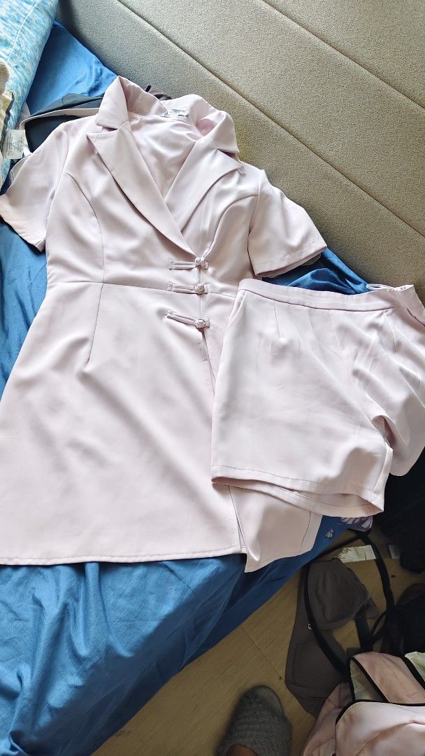 Pink Blazer Top and Shorts Set (Category: Sets or Coordinates) located in Manila. Submitted by marlynlent08149 (Listing ID 1469436731, Image 2). Description: - Matching pink short-sleeve blazer top and shorts set - Features a chic lapel collar with traditional Chinese knot frog buttons - Unique skort-style overlay on the front of the top - Soft pastel pink colour, lightweight and comfortable fabric - Versatile styling: wear together as a set or m