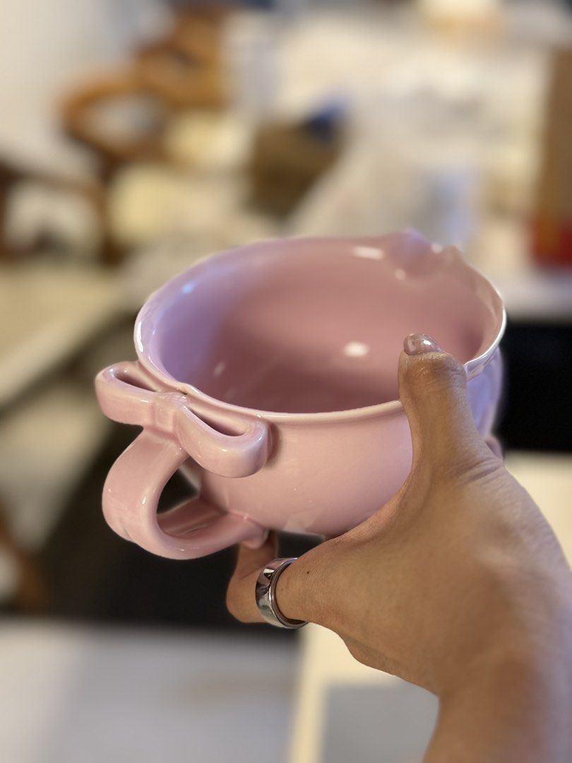 Pink Ceramic Pouring Bowl with Ribbon Handle (Category: Vases & Decorative Bowls) located in Quezon City. Submitted by pure.alexandra (Listing ID 1469530726, Image 3). Description: A cute pastel pink ceramic bowl with a unique ribbon-shaped handle and a pouring spout. Perfect for whisking matcha, preparing your favorite drinks, or adding a touch of sweetness to your matcha setup. 💗🍵 ✨ Glossy ceramic finish 🎀 Unique ribbon handle design 🍵 Perf
