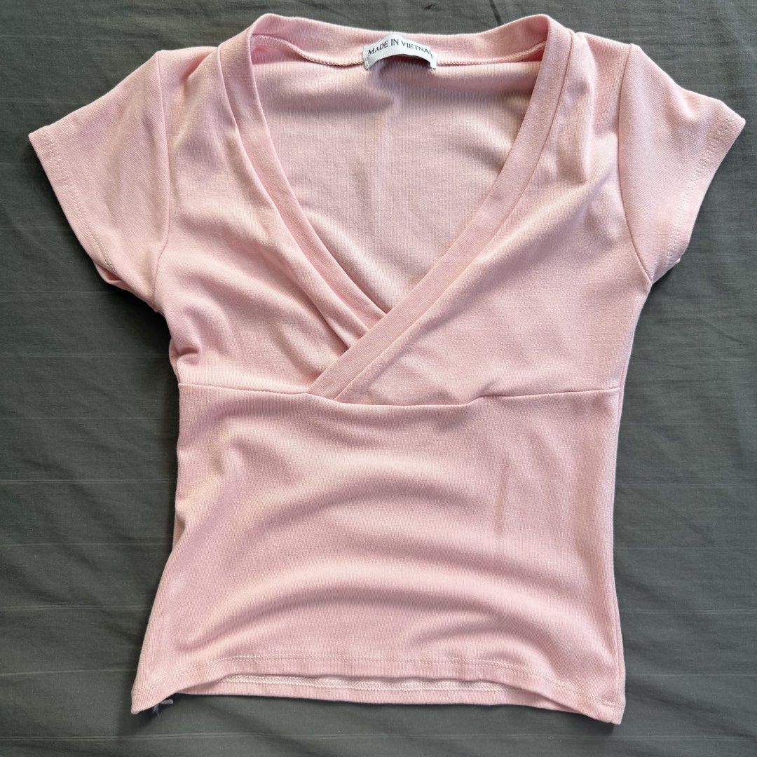 Pink crossover short sleeve top (Category: Blouses) located in Dagupan City. Submitted by matchamwa (Listing ID 1469433238, Image 1). Description: 🍡size xs 🍡washed only 🍡mop: gcash 🍡mod: lbc 🍡sf: 64-69 php.