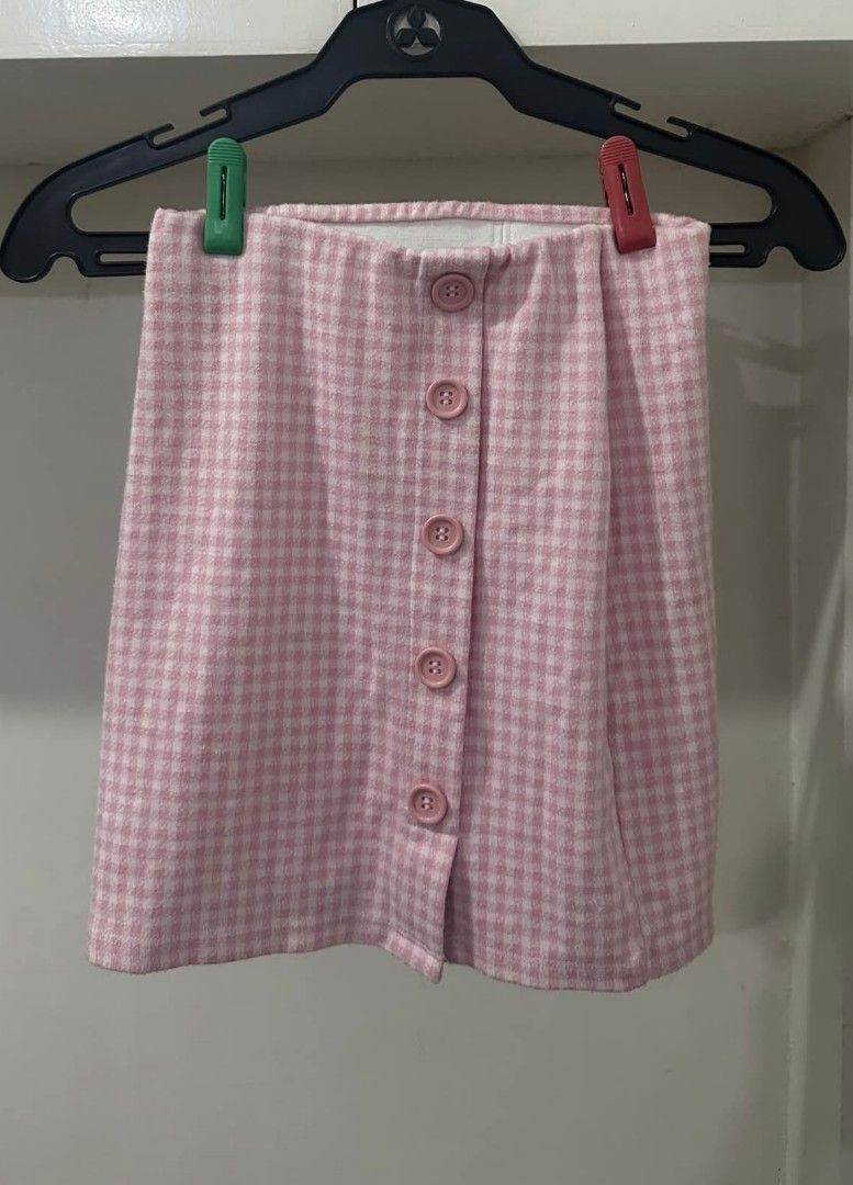 Pink Gingham Button-Front Mini Skirt (Category: Skirts) located in Manila. Submitted by livewater-0f48 (Listing ID 1469516787, Image 1). Description: - Pink and white gingham mini skirt - High-waisted fit with a five-button front closure - Crafted from a structured, woolen-texture fabric - Ideal for casual everyday outfits - 15 inches length - 12 inch waistline (garterized).