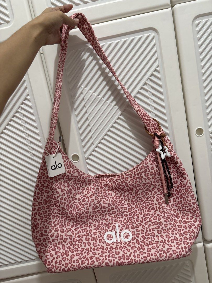 Pink Leopard Alo Shoulder Bag (Category: Tote Bags) located in Mandaluyong City. Submitted by itspink_lacey (Listing ID 1469395151, Image 2). Description: Brandnew Alo Shoulder Bag Can fit 13inch laptop With packaging, tag and charm.