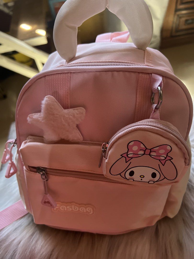 Pink My Melody Mini Backpack with Accessories (Category: Backpacks) located in Rizal. Submitted by safecat_3c0d85 (Listing ID 1469429743, Image 2). Description: - Cute pink mini backpack with bunny ears on top - Includes a detachable My Melody pouch and a fuzzy star charm - Front zippered pocket for small items - Adjustable straps for a comfortable fit - Clean pink fabric inside and out - Great day bag for Sanrio fans.