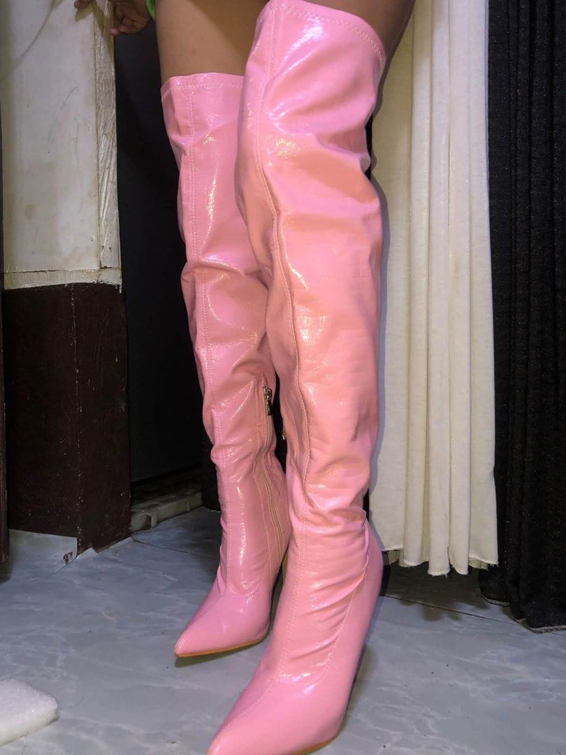 Pink Patent Leather Thigh High Boots (Category: Boots) located in Siniloan. Submitted by jassmineac88241 (Listing ID 1469537471, Image 1). Description: - Color: Bright pink - Material: Glossy patent leather - Style: Thigh-high with pointed toe and heel - Closure: Inner side zipper for easy wear - Ideal for: Parties, costumes, and nights out.