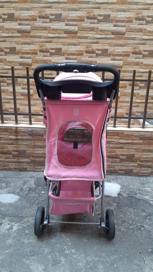 Pink Pet Stroller with Storage Basket (Category: Homes & Other Pet Accessories) located in Manila. Submitted by ysabellugh (Listing ID 1469525930, Image 3). Description: SECONDHAND PAW SMART PET STROLLER FOR SALE 🛒 ₱900 (originally bought ₱2000) RFS: Decluttering, our dogs have outgrown the stroller already 🐾 Item Details - Condition: 7.5/10 - Max Weight Capacity: 25 KG - Secondhand and well-used but still functional. - Material: pastel pink ca