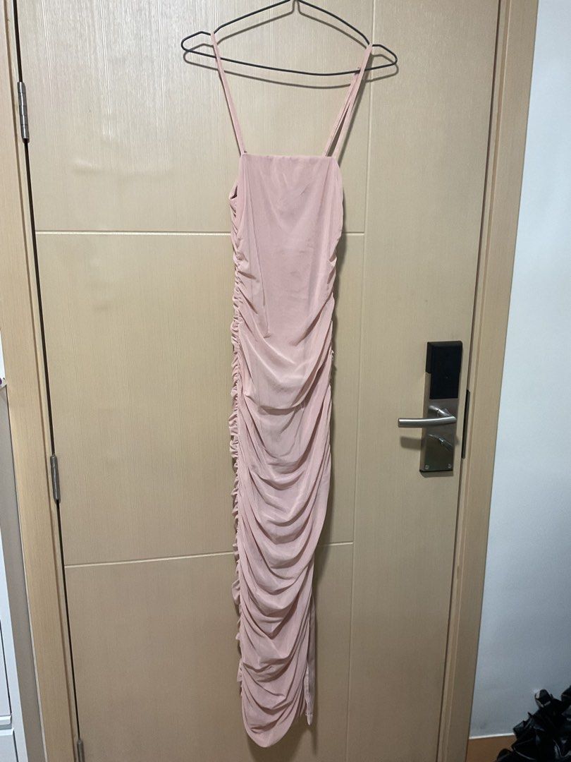 Pink Ruched Bodycon Maxi Dress Spaghetti Strap (Category: Dresses) located in Quezon City. Submitted by patriciam.02 (Listing ID 1469496059, Image 3). Description: - Style: Bodycon maxi dress in light pink - Design: Full ruched detailing down the side and back, sleeveless with spaghetti straps and slip-on style - Fabric: Stretchy mesh-like material that hugs your curves - Condition: Worn once for a party, no flaws/like new - Perfect for: Parties,