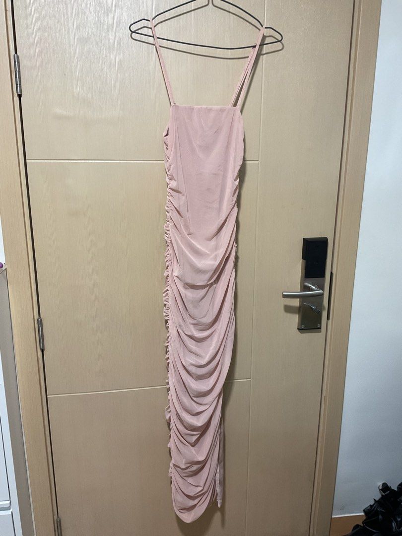 Pink Ruched Bodycon Maxi Dress Spaghetti Strap (Category: Dresses) located in Quezon City. Submitted by patriciam.02 (Listing ID 1469496059, Image 2). Description: - Style: Bodycon maxi dress in light pink - Design: Full ruched detailing down the side and back, sleeveless with spaghetti straps and slip-on style - Fabric: Stretchy mesh-like material that hugs your curves - Condition: Worn once for a party, no flaws/like new - Perfect for: Parties,