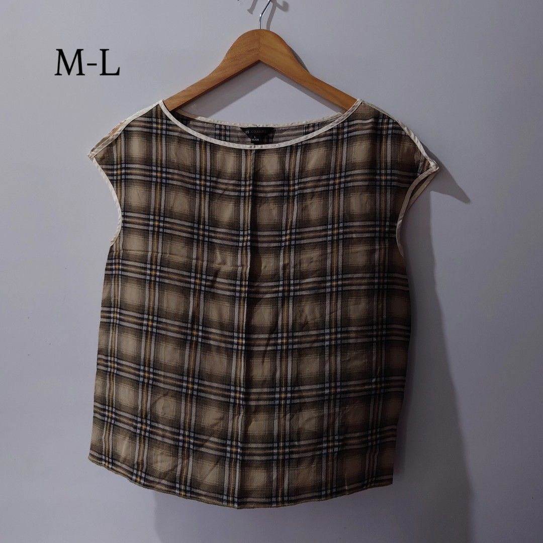 Plaid Brown Cap Sleeve Blouse M-L (Category: Blouses) located in Diffun. Submitted by declutteredbyJill (Listing ID 1469501939, Image 1). Description: - Brown and beige plaid sleeveless top - Scoop neck with light trim detail - Loose fit, lightweight and breathable for warm weather - Tagged size L, comfortably fits M to L - Easy to pair with skirts or trousers - Clean and well-kept condition.