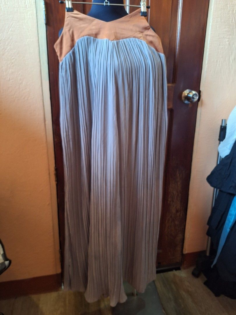 Pleated wide-leg pants (Category: Jumpsuits) located in Balamban. Submitted by ubethan (Listing ID 1469457319, Image 1). Description: Waist: 34.5 in" Hip: 38 in" Length: 44 in" - Style: Pleated wide-leg - Colors: Brown bodice with grey trousers - Closure: Convenient side zipper - Fit: Comfortable and long flowy fabric - Occasion: Great for casual outings or evening events.