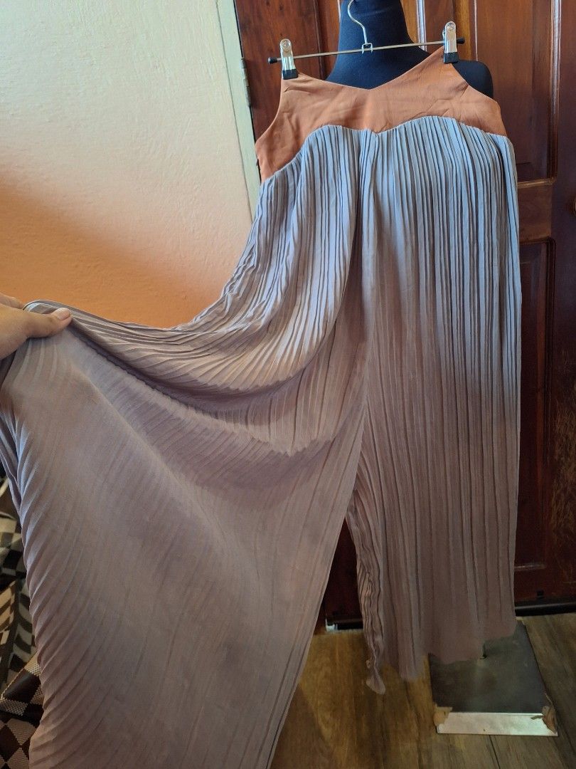 Pleated wide-leg pants (Category: Jumpsuits) located in Balamban. Submitted by ubethan (Listing ID 1469457319, Image 3). Description: Waist: 34.5 in" Hip: 38 in" Length: 44 in" - Style: Pleated wide-leg - Colors: Brown bodice with grey trousers - Closure: Convenient side zipper - Fit: Comfortable and long flowy fabric - Occasion: Great for casual outings or evening events.