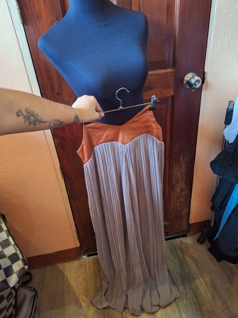 Pleated wide-leg pants (Category: Jumpsuits) located in Balamban. Submitted by ubethan (Listing ID 1469457319, Image 2). Description: Waist: 34.5 in" Hip: 38 in" Length: 44 in" - Style: Pleated wide-leg - Colors: Brown bodice with grey trousers - Closure: Convenient side zipper - Fit: Comfortable and long flowy fabric - Occasion: Great for casual outings or evening events.