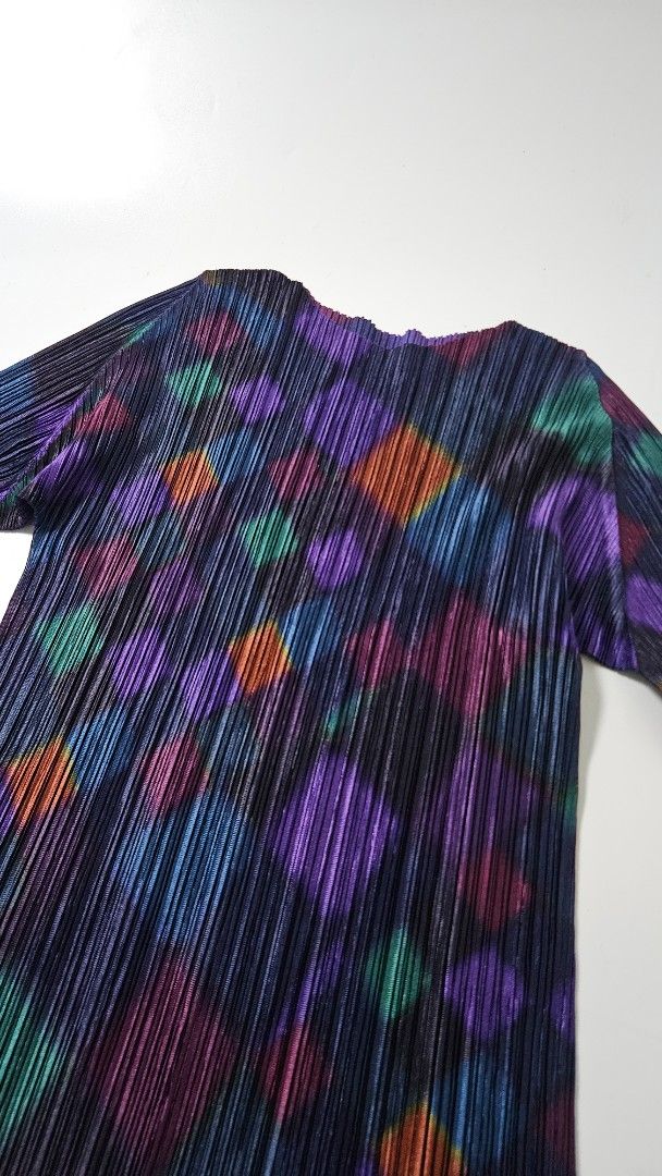 Pleats Please Issey Miyake Multicolored Diamond Pleated Top (Category: Blouses) located in Alfonso. Submitted by jbcamet (Listing ID 1469513921, Image 2). Description: - Brand: Pleats Please Issey Miyake - Size: 3 (Classic stretch fit) - Material: 100% Polyester - Origin: Made in Japan - Design: Vibrant multicolored diamond geometric pattern on dark pleated fabric - Features: Long sleeves, signature permanent pleats - Details: Style code PP93-JK7