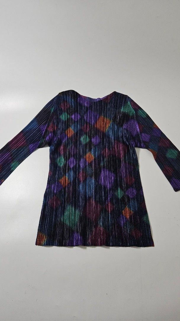 Pleats Please Issey Miyake Multicolored Diamond Pleated Top (Category: Blouses) located in Alfonso. Submitted by jbcamet (Listing ID 1469513921, Image 1). Description: - Brand: Pleats Please Issey Miyake - Size: 3 (Classic stretch fit) - Material: 100% Polyester - Origin: Made in Japan - Design: Vibrant multicolored diamond geometric pattern on dark pleated fabric - Features: Long sleeves, signature permanent pleats - Details: Style code PP93-JK7