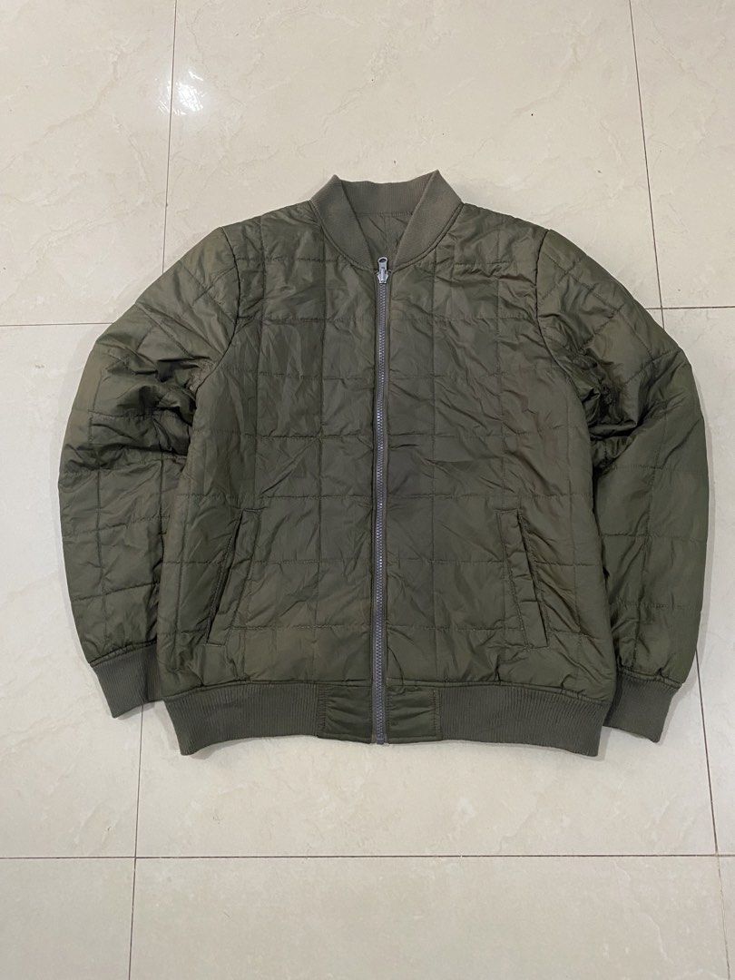 PLUSH RICH REVERSIBLE ARMY GREEN PUFFTECH BOMBER JACKET (Category: Coats, Jackets and Outerwear) located in Talisay. Submitted by hustlethrift_2600 (Listing ID 1469560487, Image 2). Description: PLUSH RICH REVERSIBLE ARMY GREEN PUFFTECH BOMBER JACKET M ON TAG S-M 20 W 24 L EXCELLENT CONDITION 9.9/10 COLOR RATE REVERSIBLE WATER RESISTANT FABRIC NO ISSUE - 1099.