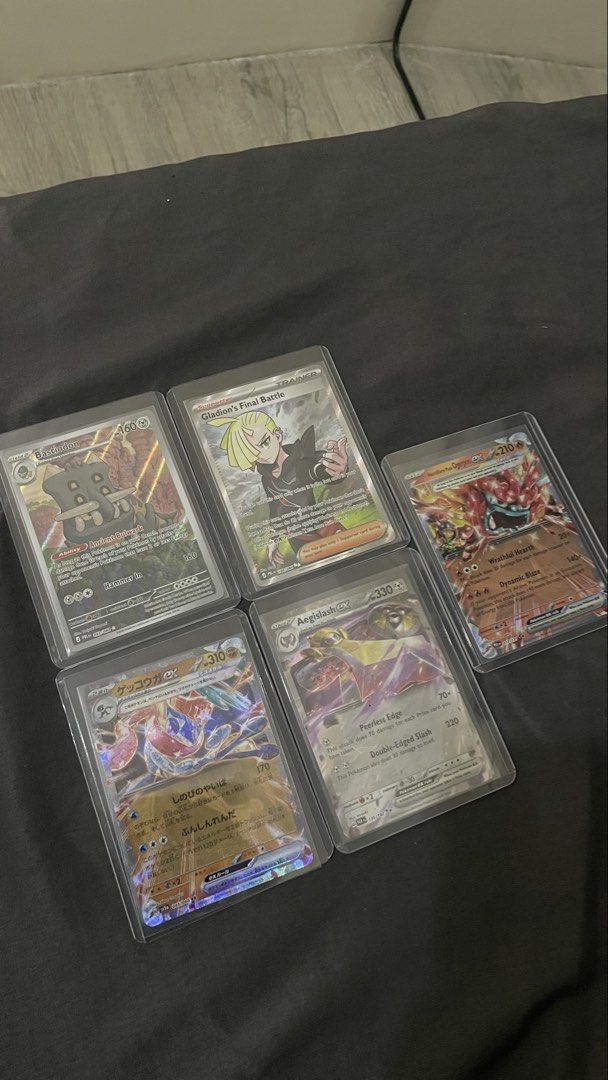 Pokemon cards as set (Category: Card Packs) located in Las Pinas. Submitted by tinngonzaga (Listing ID 1469505799, Image 2). Description: Heartflame mask ogerpon - us Aegislash - us Gladion's final battle - us Bastiodon - us Greninja ex - jap With protector .
