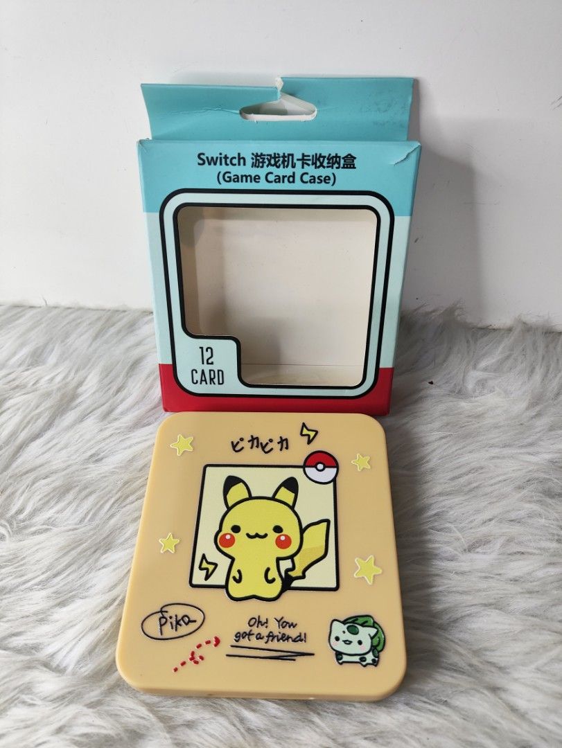 Pokémon Pikachu Nintendo Switch Game Card Case 12 Slots (Category: Trading Cards Accessories) located in Cavite. Submitted by tinetaclesss (Listing ID 1469499714, Image 1). Description: - Color: Bright yellow with cute Pikachu and Bulbasaur cover graphics - Capacity: Securely holds up to 12 Nintendo Switch game cartridges in molded slots - Packaging: Includes original retail box - Perfect for safe storage and portable gaming.