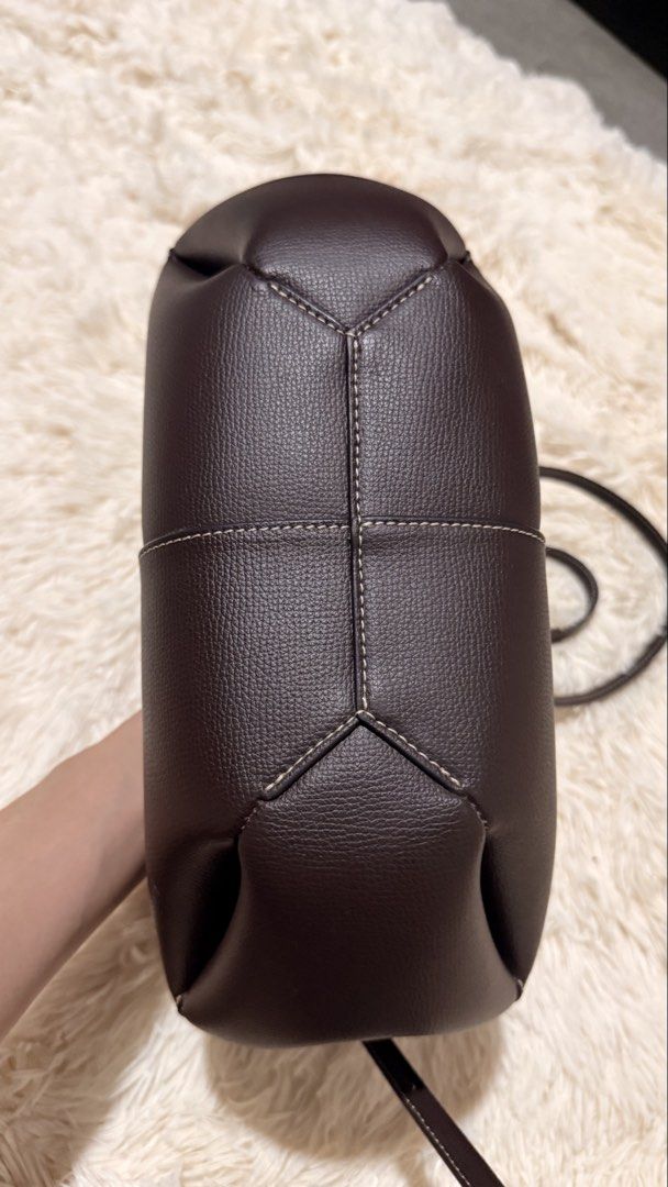 Polene Cyme Mini Ebony (Category: Luxury Bags & Wallets) located in Pasay City. Submitted by erinsclosetph (Listing ID 1469428195, Image 3). Description: Polène Cyme Mini – Ebony Pre-loved Polène Cyme Mini in Ebony. Leather and bag structure are in good condition. Flaws: Shows signs of use, including dirt on the inner lining and missing side fringe trim. Inclusions: Pouch, bag tag, and care card only..