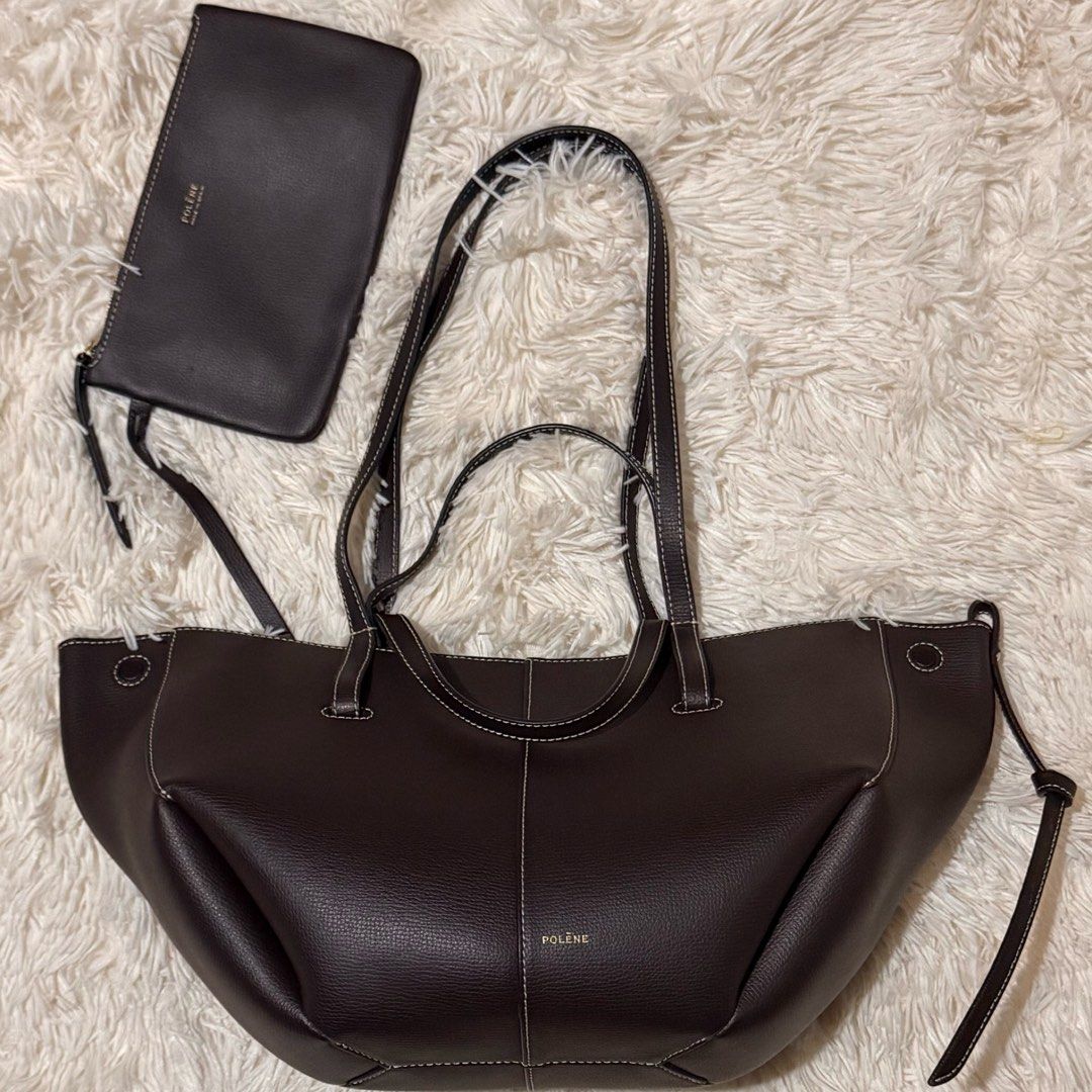Polene Cyme Mini Ebony (Category: Luxury Bags & Wallets) located in Pasay City. Submitted by erinsclosetph (Listing ID 1469428195, Image 1). Description: Polène Cyme Mini – Ebony Pre-loved Polène Cyme Mini in Ebony. Leather and bag structure are in good condition. Flaws: Shows signs of use, including dirt on the inner lining and missing side fringe trim. Inclusions: Pouch, bag tag, and care card only..