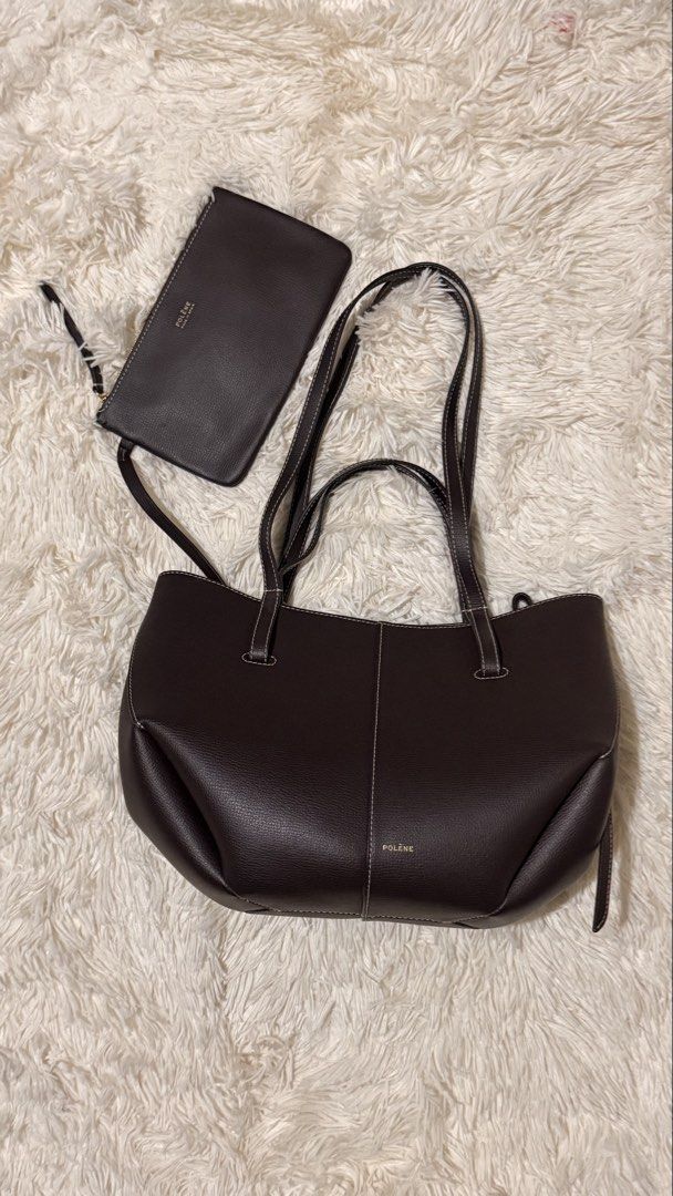Polene Cyme Mini Ebony (Category: Luxury Bags & Wallets) located in Pasay City. Submitted by erinsclosetph (Listing ID 1469428195, Image 2). Description: Polène Cyme Mini – Ebony Pre-loved Polène Cyme Mini in Ebony. Leather and bag structure are in good condition. Flaws: Shows signs of use, including dirt on the inner lining and missing side fringe trim. Inclusions: Pouch, bag tag, and care card only..