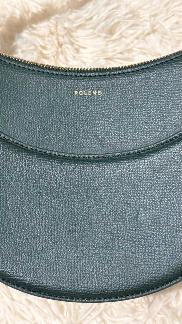 Polene Numero Dix Green (Category: Luxury Bags & Wallets) located in Pasay City. Submitted by erinsclosetph (Listing ID 1469421369, Image 3). Description: Polène Numéro Dix – Green Pre-loved Polène Numéro Dix in green, worn crossbody. Shows signs of wear, including stains and scratches on the leather. Lining and piping are in great condition, with a clean interior. Inclusions: None .