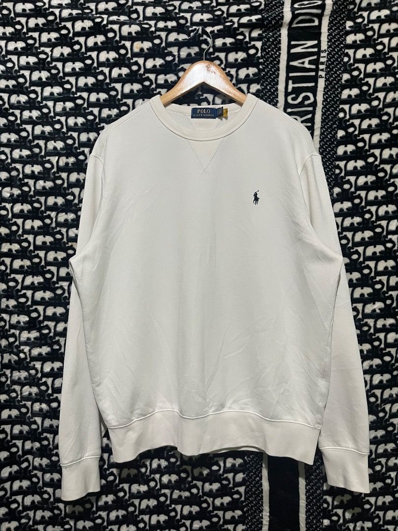 Polo Ralph Lauren White Sweatshirt (Category: Coats, Jackets and Outerwear) located in Valencia. Submitted by vncnttroy (Listing ID 1469439015, Image 1). Description: - Brand: Polo Ralph Lauren - Color: Crisp white - Design: Classic crewneck with V-stitch detail - Branding: Small embroidered dark pony logo on the left chest - Details: Long sleeves, ribbed cuffs and hem, blue label with QR code tags - Style: Versatile casual piece, perfect with je