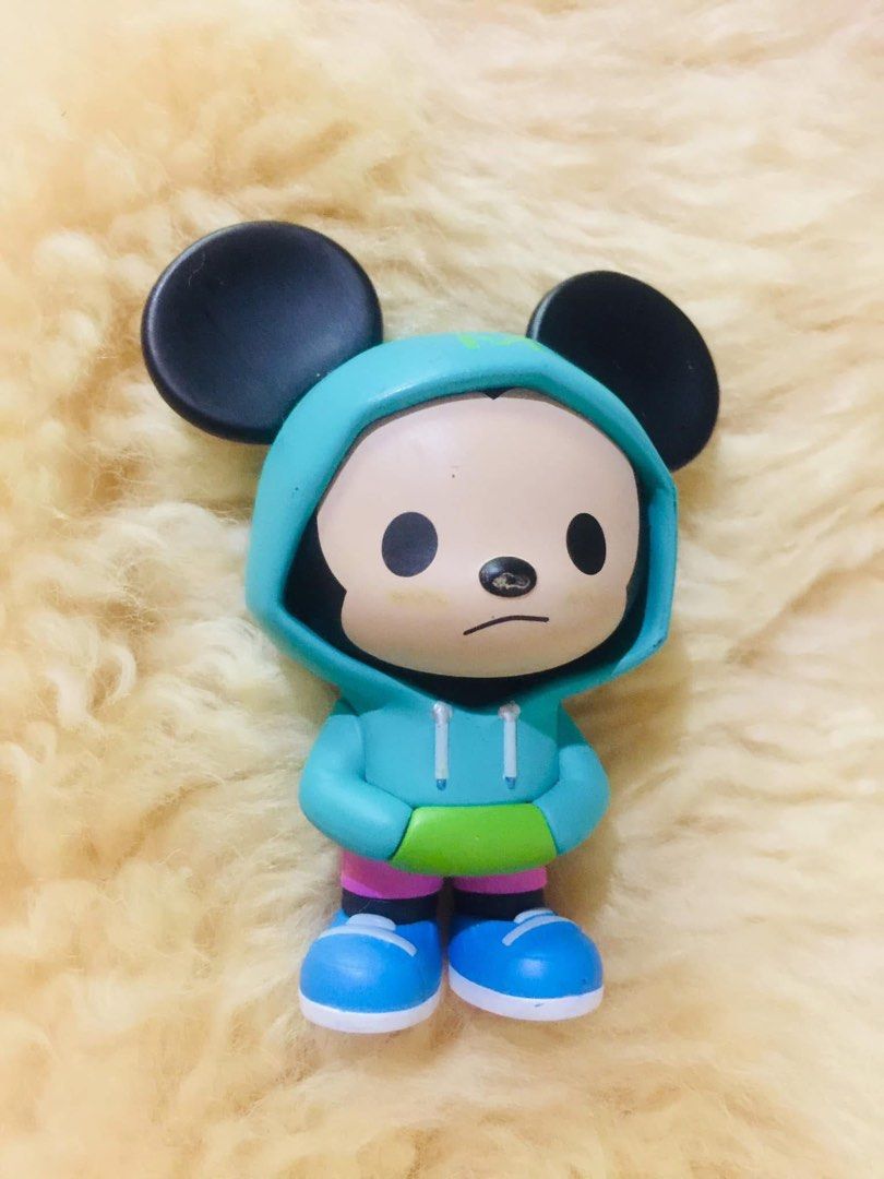 POP MART Disney Mickey Mouse Vinyl Figure (Category: Designer & Blind Box Toys) located in Baguio. Submitted by izza_thrifty (Listing ID 1469567910, Image 1). Description: - Authentic Pop Mart Disney Mickey Mouse vinyl figure - Stylish outfit: teal hoodie with Mickey logo on the back, pink shorts, and blue sneakers - Features authentic stamps printed on the bottom of the shoes - Stands upright easily for display - Condition: Shows light scuffs an
