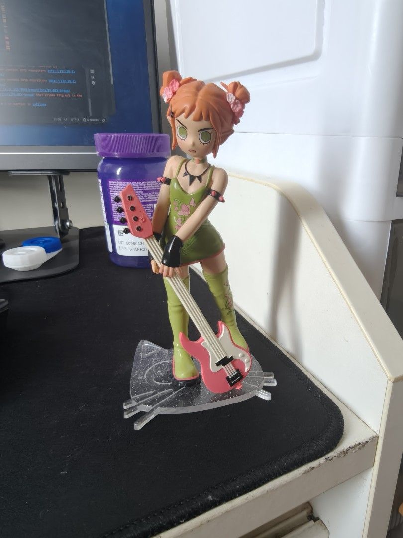 Popmart Peach Riot (Gigi) Figure (Category: Figurines & Statues) located in Las Pinas. Submitted by ricopogi (Listing ID 1469406458, Image 1). Description: - Vibrant anime figure featuring orange hair in twin buns with flower pins - Wears a matching green dress and green stockings - Holding a detailed pink and red electric guitar - Sturdy build, stands upright without any issues on a clear patterned base - Excellent paint job and overall conditio