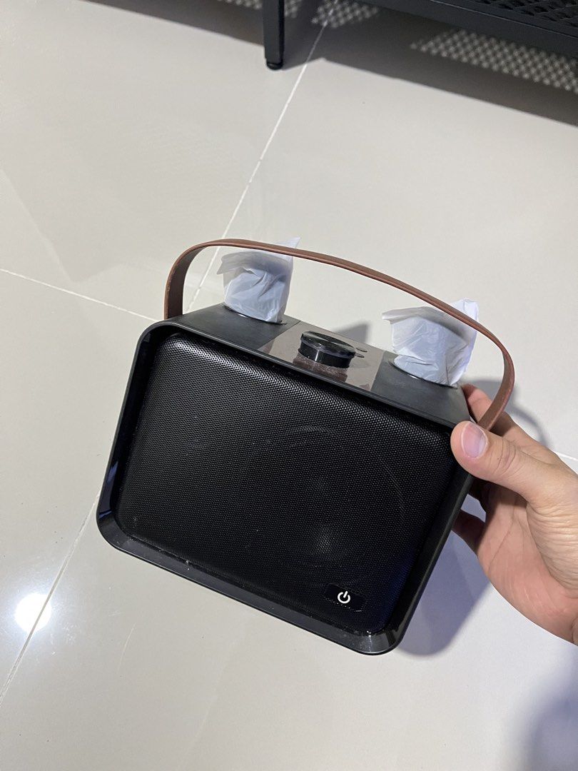 RUSH SALE Portable Bluetooth Speaker with Leather Handle and Volume Knob - NEGO (Category: Soundbars, Speakers & Amplifiers) located in Manila. Submitted by curated.clutter12 (Listing ID 1469516232, Image 1). Description: - Color & Design: Sleek black finish with a premium brown leather carrying strap - Controls: Features a large volume dial and multiple easy-access buttons on the top panel - Connectivity & Ports: Equipped with an auxiliary jack,