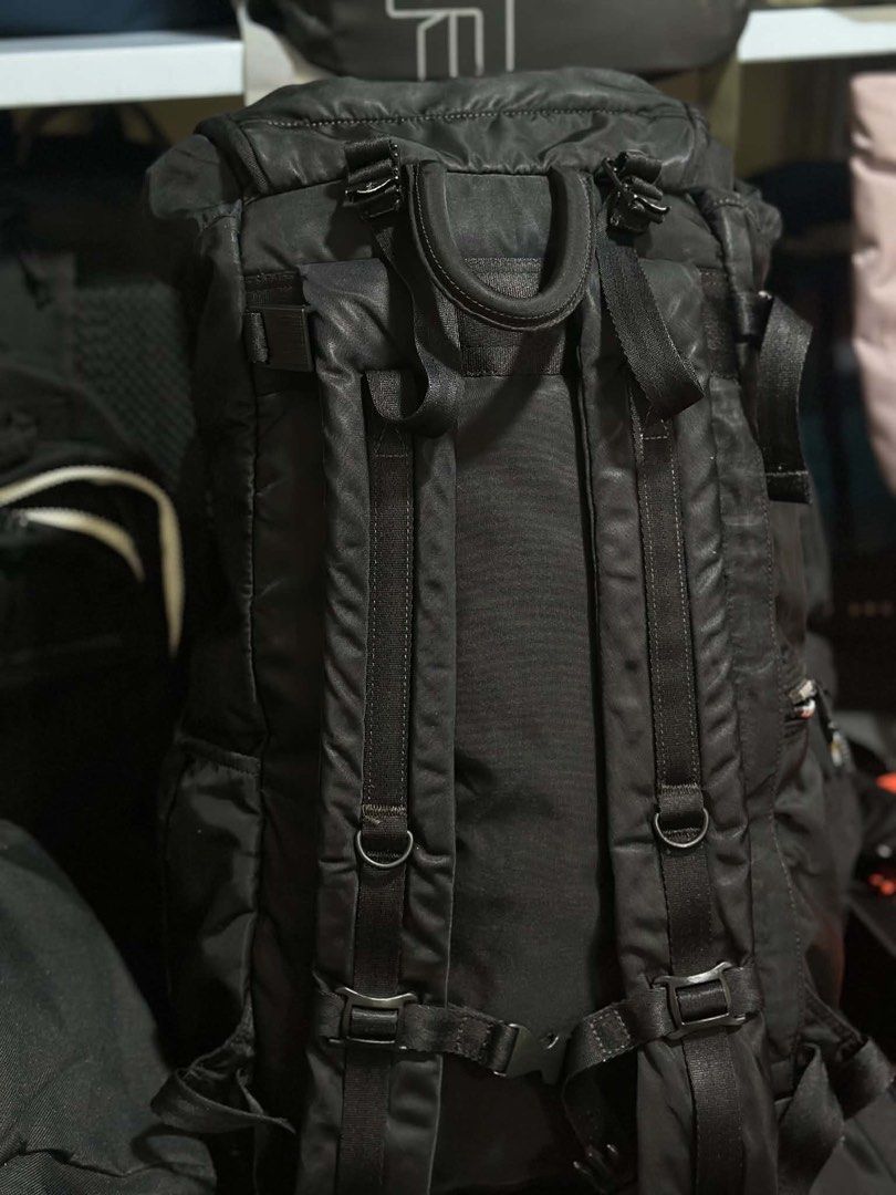 Porter International Black Nylon Backpack (Category: Luxury Bags & Wallets) located in Baguio. Submitted by annecicat (Listing ID 1469512166, Image 3). Description: - Brand: Porter International - Color: Classic solid black - Material: Highly durable, weather-resistant nylon - Closure: Secure fold-over top flap with buckle - Features: Multiple compartments, inner zip pockets, and signature branded fabric lining - Comfort: Adjustable shoulder stra