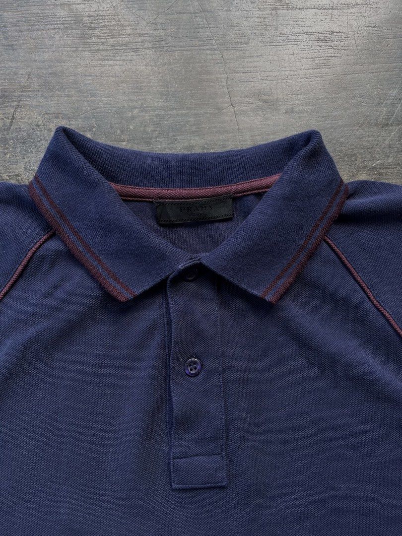 Pr4da Navy Blue Polo Shirt (Category: Tshirts & Polo Shirts ) located in Kalibo. Submitted by notdavaaa (Listing ID 1469498337, Image 2). Description: Size: Medium fittings Dimes: W: 19 L: 27 Excellent condition, cut washtag Color Rate: 9.8/10.