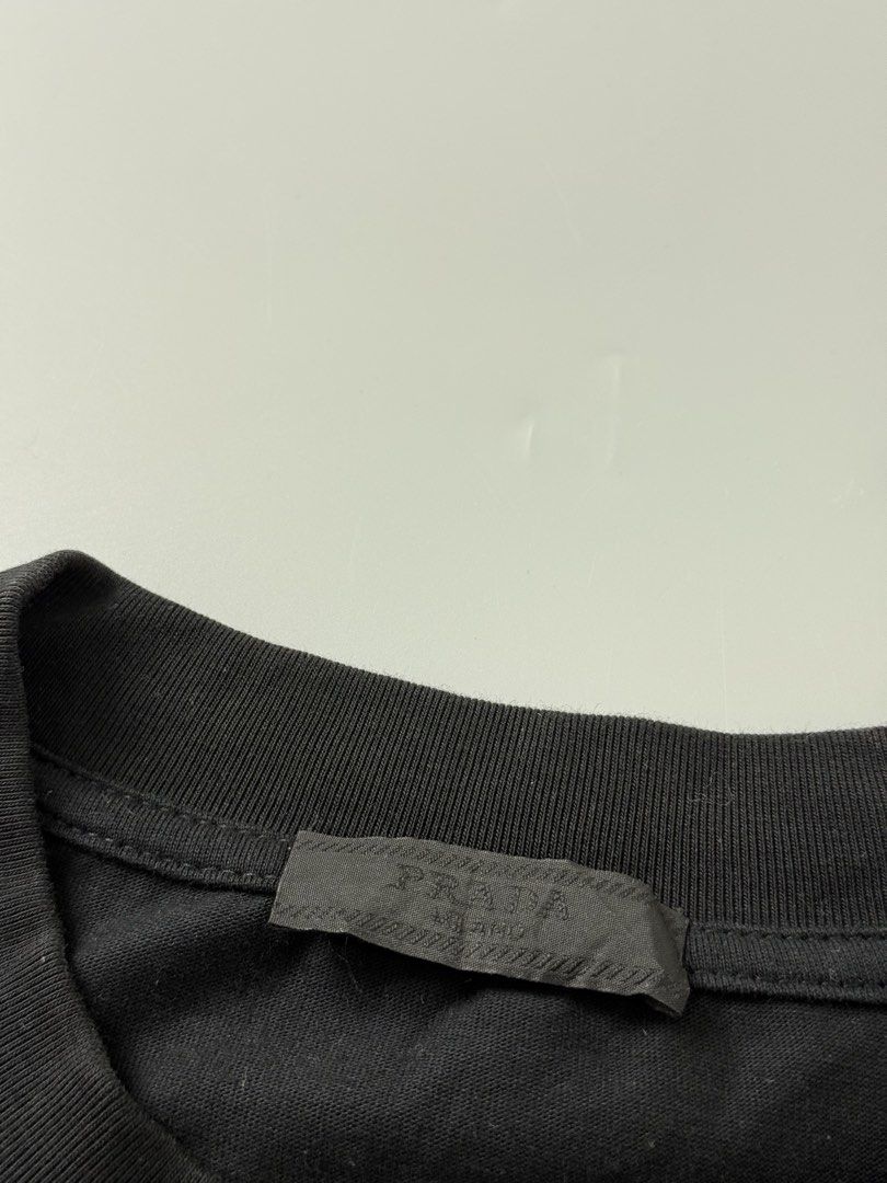 Prada (Category: Tshirts & Polo Shirts ) located in Pila. Submitted by villanueva80826 (Listing ID 1469530858, Image 3). Description: Prada midlogo Size:xl •Width:24 •Length:29 •Condition:9/10 •Color rate:9.5/10 Mine:480 +Shipping fee Issue:scratch penhole on back Still in good condition Still wearable .