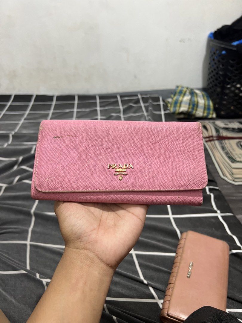 Prada - Wallet - Leather (Category: Wallets & Card Holders) located in Cavite. Submitted by asianluxe (Listing ID 1469526847, Image 1). Description: Good condition Very presentable Minimal flaw Authentic .