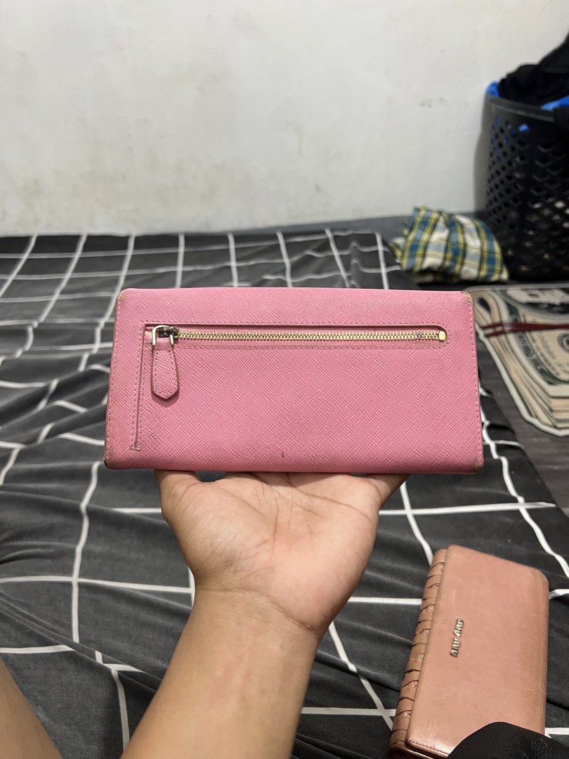 Prada - Wallet - Leather (Category: Wallets & Card Holders) located in Cavite. Submitted by asianluxe (Listing ID 1469526847, Image 2). Description: Good condition Very presentable Minimal flaw Authentic .