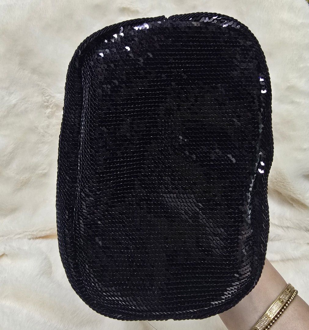 Prada Black Sequin Bucket Bag (Category: Luxury Bags & Wallets) located in Manila. Submitted by brandedshoppe_mnl (Listing ID 1469490414, Image 3). Description: - Brand: Authentic Prada - Style: Sequin bucket bag - Color/Material: Black sequins with leather handles - Hardware: Gold-tone with classic triangle logo plate - Closure: Drawstring - Structure: Flat bottom base - Condition: Pristine, clean interior and exterior with no missing sequins -E