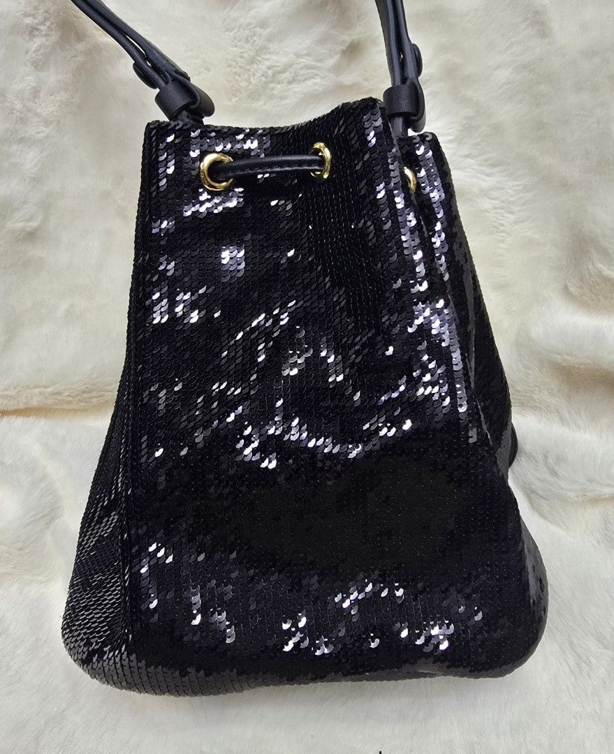 Prada Black Sequin Bucket Bag (Category: Luxury Bags & Wallets) located in Manila. Submitted by brandedshoppe_mnl (Listing ID 1469490414, Image 2). Description: - Brand: Authentic Prada - Style: Sequin bucket bag - Color/Material: Black sequins with leather handles - Hardware: Gold-tone with classic triangle logo plate - Closure: Drawstring - Structure: Flat bottom base - Condition: Pristine, clean interior and exterior with no missing sequins -E