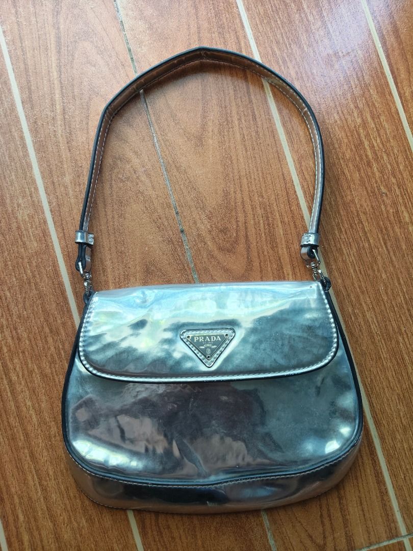 Prada metallic silver shoulder bag (Category: Luxury Bags & Wallets) located in Caloocan City. Submitted by balizaclar77072 (Listing ID 1469491785, Image 1). Description: - Authentic Prada shoulder bag in a chic metallic silver finish - Secure flap closure with magnetic snap and silver-tone hardware - Matching metallic interior lining featuring the iconic Prada Made in Italy metal plaque - Compact size, ideal for carrying daily essentials or for 