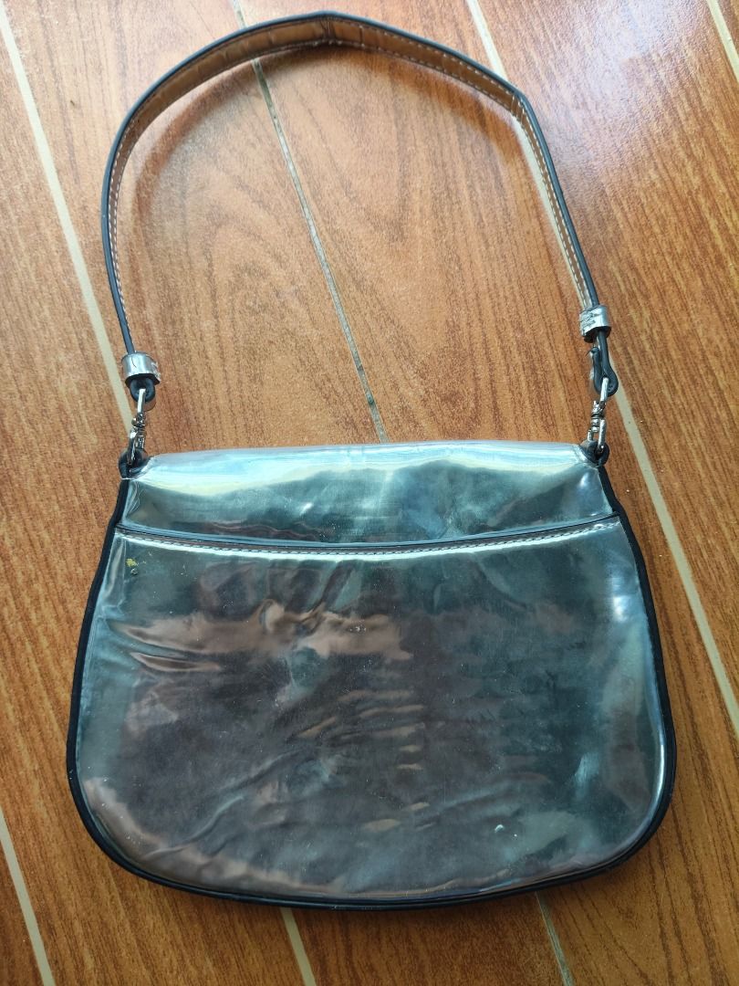 Prada metallic silver shoulder bag (Category: Luxury Bags & Wallets) located in Caloocan City. Submitted by balizaclar77072 (Listing ID 1469491785, Image 2). Description: - Authentic Prada shoulder bag in a chic metallic silver finish - Secure flap closure with magnetic snap and silver-tone hardware - Matching metallic interior lining featuring the iconic Prada Made in Italy metal plaque - Compact size, ideal for carrying daily essentials or for 