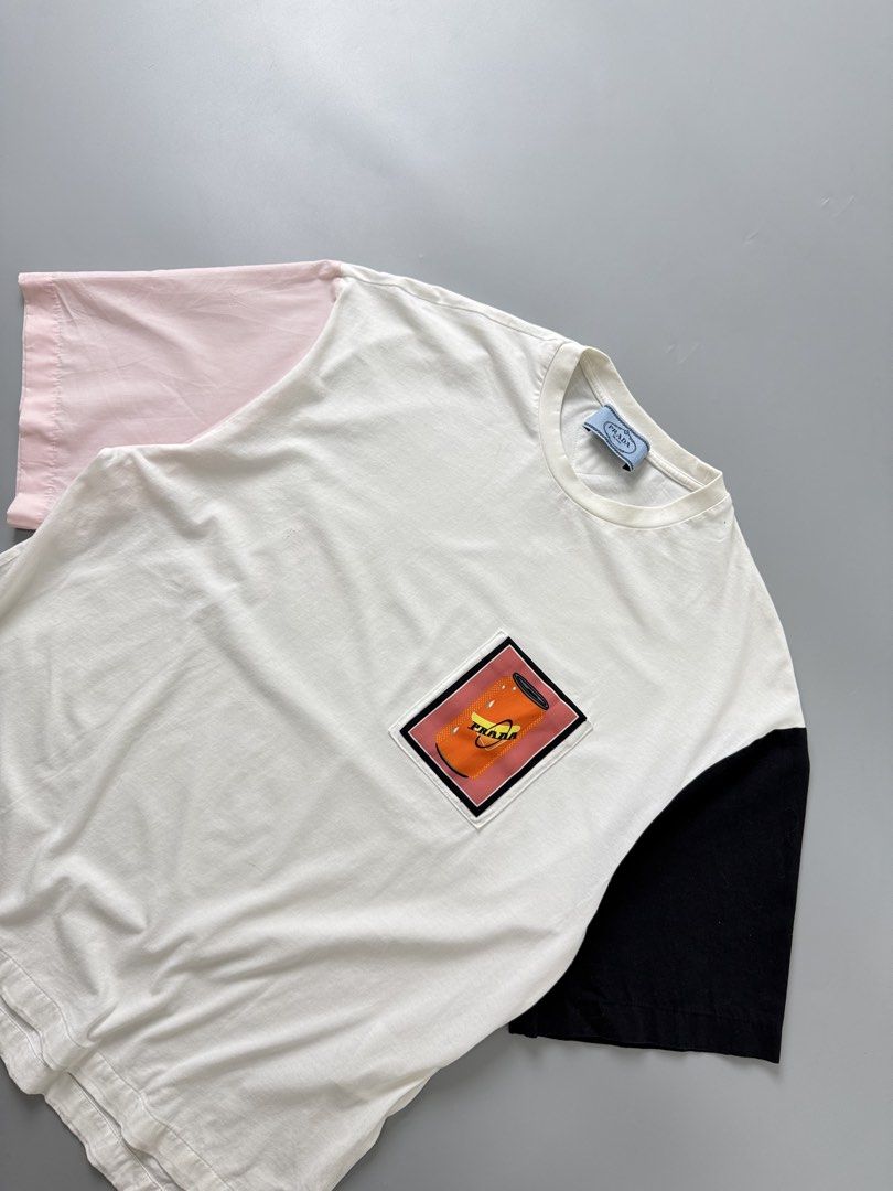 Prada pocket tee (Category: Tshirts & Polo Shirts ) located in Pila. Submitted by villanueva80826 (Listing ID 1469531229, Image 2). Description: Prada pocket tee Size:xl •Width:21 •Length:25.5 •Condition:9/10 •Color rate:9/10 Mine:680 +Shipping fee Issue:sign of usage likr pinhole on stitch not noticeable Still in good condition Still wearable .