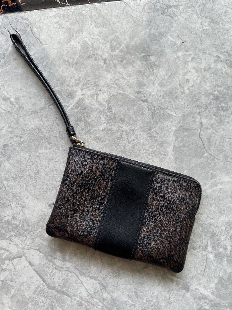 Preloved Coach Wristlet (Category: Wallets & Card holders) located in Manila. Submitted by angc_finds (Listing ID 1469419586, Image 1). Description: Please check photos for issues ₱600 📍Marina, Parañaque.