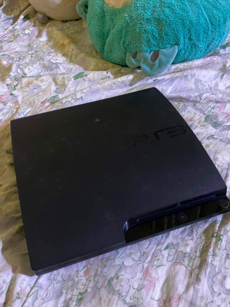 PS3 Slim w/ 2 controllers & pre-installed games (Category: PlayStation) located in Caloocan City. Submitted by oddwater-f921 (Listing ID 1469527367, Image 2). Description: -Price is negotiable - Authentic Sony PlayStation 3 Slim console - Tested and 100% working (screen proof in photos) - Includes 2 working wireless controllers - Comes with power cable and extra connection cables - Condition: Normal signs of handling and light surface dust - Perf