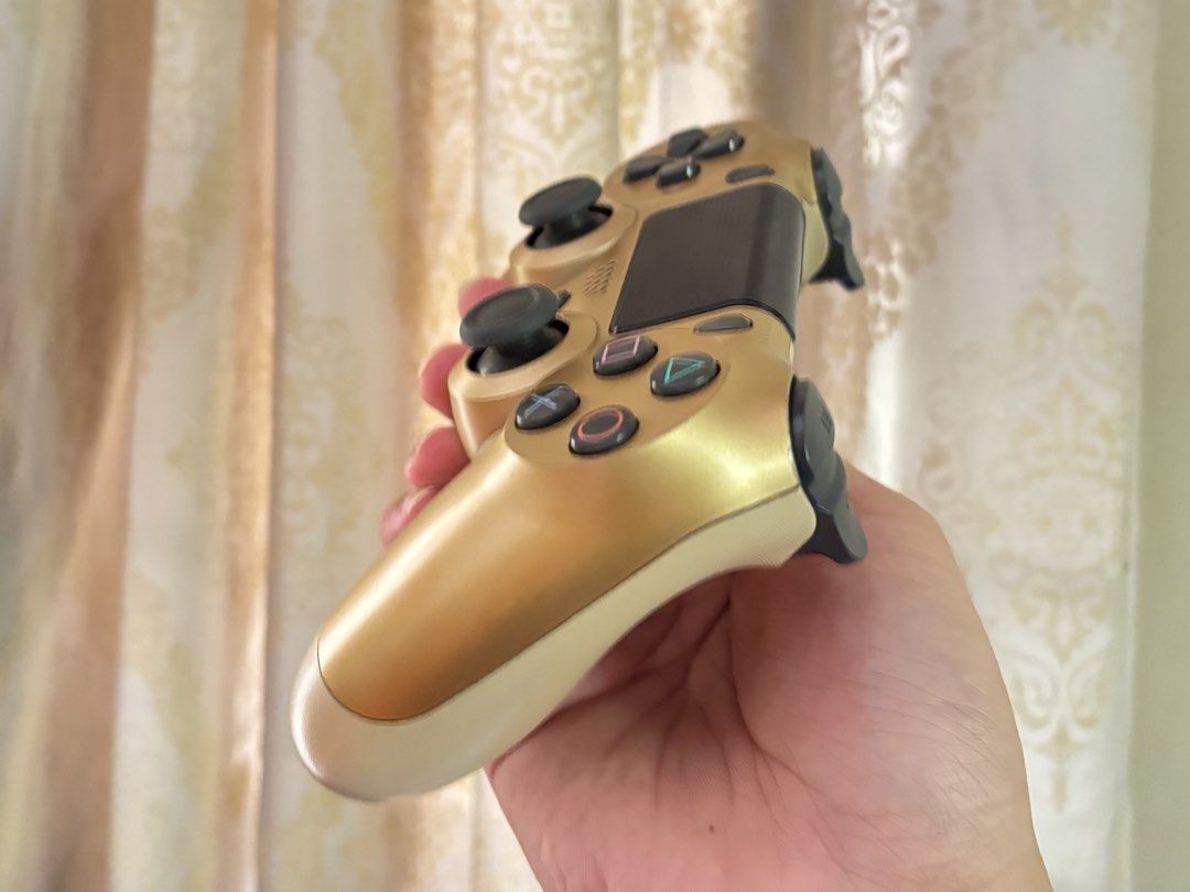 PS4 Games Bundle and Gold DualShock 4 Controller (Category: PlayStation) located in Manila. Submitted by jarrd.xx (Listing ID 1469406358, Image 2). Description: - PS4 gaming bundle in great working condition - Includes 6 popular game discs: Street Fighter V, Tekken 7, Driveclub, EA Sports UFC, Crash Bandicoot N. Sane Trilogy, and Injustice Gods Among Us Ultimate Edition - Comes with an official Sony DualShock 4 wireless controller in a stylish go