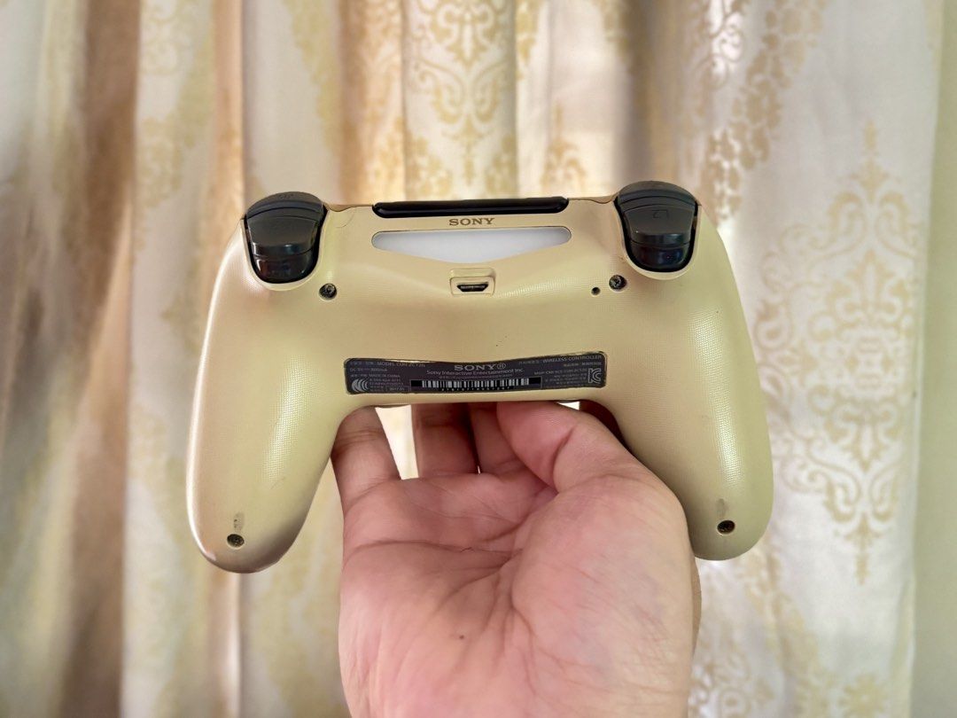 PS4 Games Bundle and Gold DualShock 4 Controller (Category: PlayStation) located in Manila. Submitted by jarrd.xx (Listing ID 1469406358, Image 3). Description: - PS4 gaming bundle in great working condition - Includes 6 popular game discs: Street Fighter V, Tekken 7, Driveclub, EA Sports UFC, Crash Bandicoot N. Sane Trilogy, and Injustice Gods Among Us Ultimate Edition - Comes with an official Sony DualShock 4 wireless controller in a stylish go